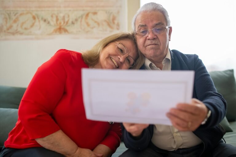 a man and woman looking at a piece of paper